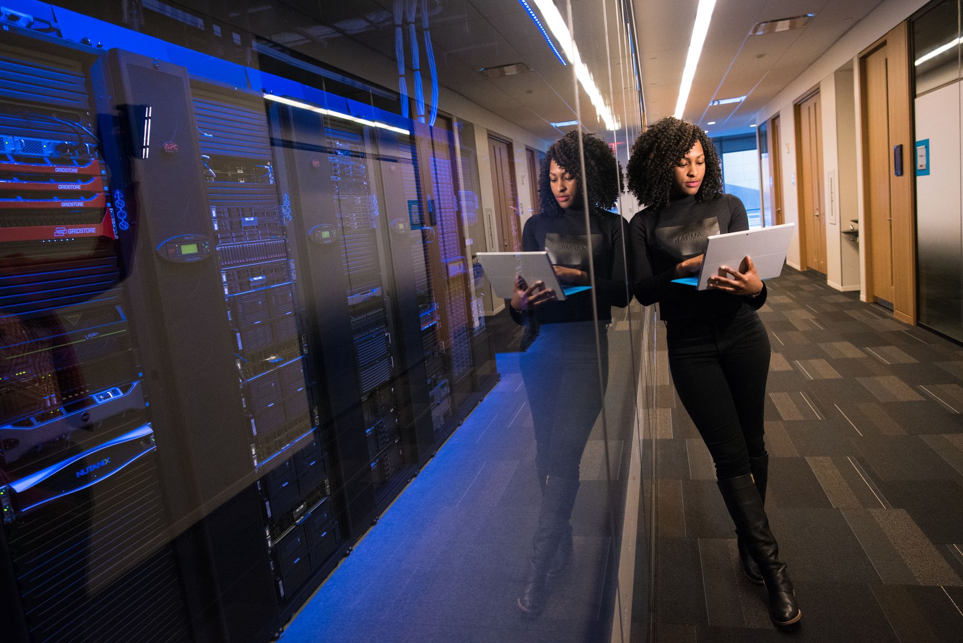 Engineers monitoring live cloud migration dashboards in a data center operations room
