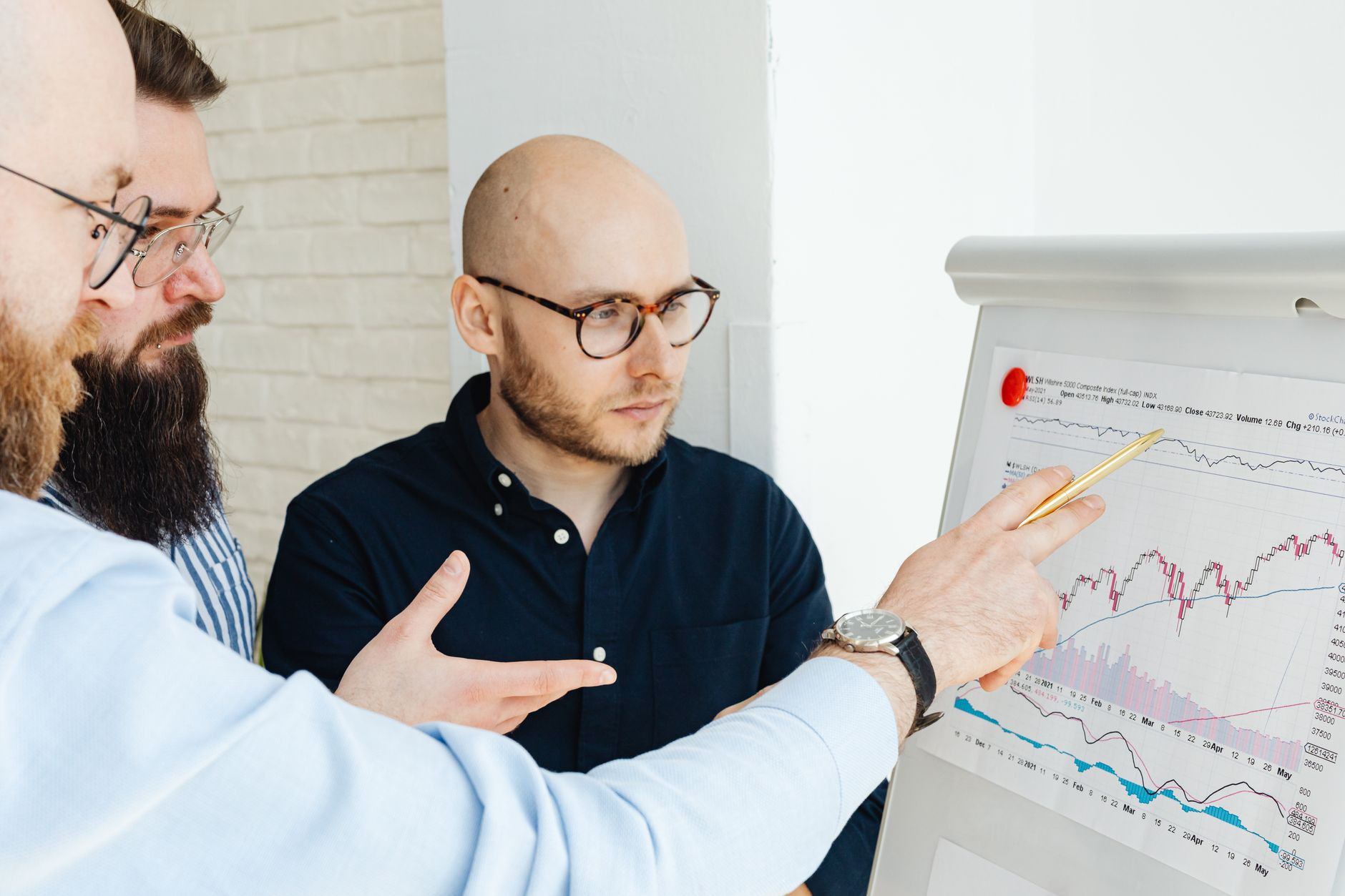 A consulting team collaborating with enterprise stakeholders around a data strategy whiteboard session